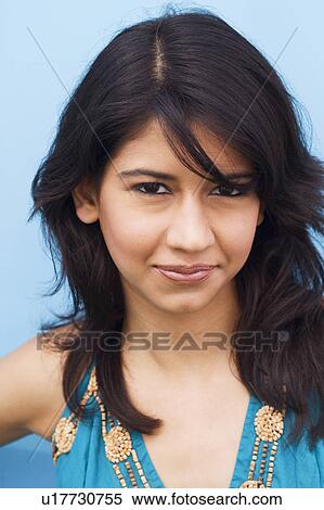 Portrait of a young woman grinning View Large Photo Image Stock Photography - Portrait of a young woman grinning. Fotosearch
