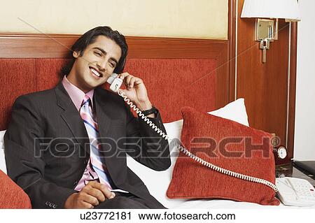 Close-up of a businessman talking on the telephone View Large Photo Image Stock Image - Close-up of a businessman talking on the telephone. Fotosearch
