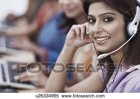Portrait of a businesswoman wearing a headset View Large Photo Image Stock Photography - Portrait of a businesswoman wearing a headset. Fotosearch