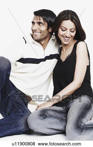 Stock Photo - Close-up of a young couple smiling. Fotosearch