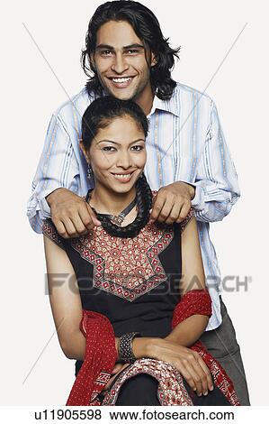 Stock Photo - Portrait of a mid adult couple smiling. Fotosearch