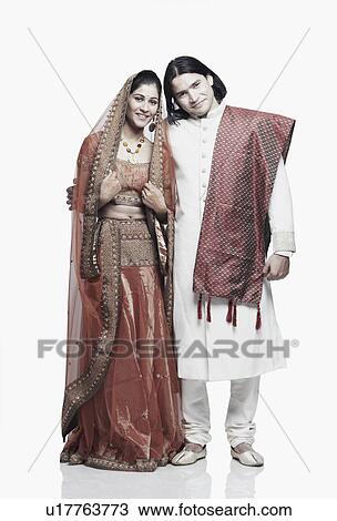 Portrait of a newlywed couple smiling View Large Photo Image Stock Image - Portrait of a newlywed couple smiling. Fotosearch