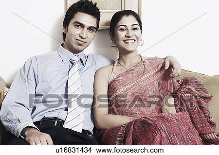 Portrait of a young couple smiling View Large Photo Image Picture - Portrait of a young couple smiling. Fotosearch