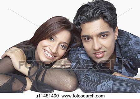 Stock Image - Portrait of a young couple smiling. Fotosearch