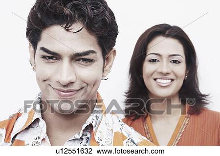Portrait of a young couple smiling View Large Photo Image Stock Image - Portrait of a young couple smiling. Fotosearch