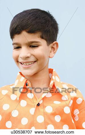 Stock Photo - Close-up of a boy smiling. Fotosearch