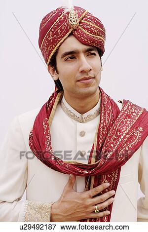Stock Photo - Groom wearing a traditional wedding outfit. Fotosearch