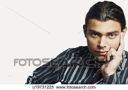 Stock Photography - Portrait of a businessman looking serious. Fotosearch
