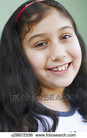 Portrait of a girl smiling View Large Photo Image Stock Photograph - Portrait of a girl smiling. Fotosearch
