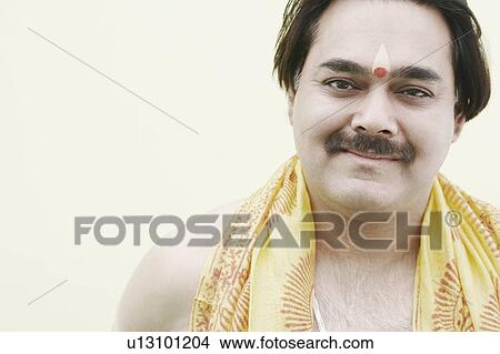 Picture - Portrait of a priest smiling. Fotosearch