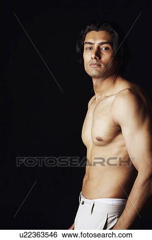 Stock Photograph - Portrait of a young man posing. Fotosearch
