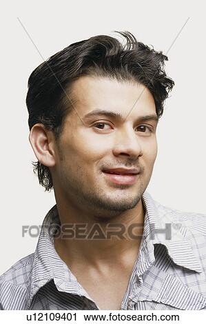 Stock Image - Portrait of a young man smiling. Fotosearch