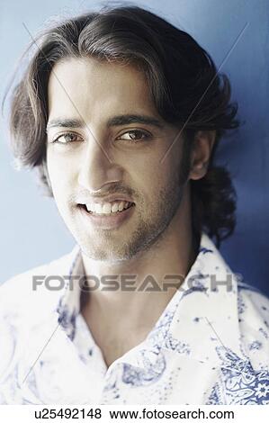 Portrait of a young man smiling View Large Photo Image Stock Photo - Portrait of a young man smiling. Fotosearch