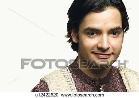 Stock Image - Portrait of a young man smirking. Fotosearch