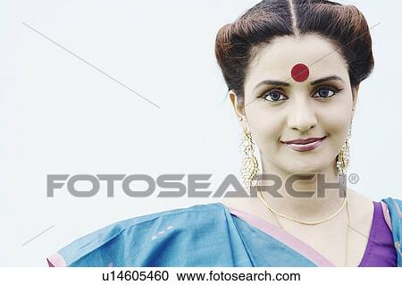 Stock Image - Portrait of a young woman wearing a sari. Fotosearch