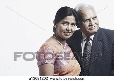 Stock Image - Close-up of a mature couple smiling. Fotosearch