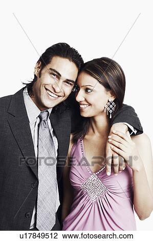 Close-up of a young couple smiling View Large Photo Image Stock Image - Close-up of a young couple smiling. Fotosearch