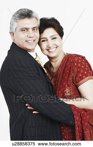Portrait of a mature couple embracing each other View Large Photo Image Stock Photography - Portrait of a mature couple embracing each other. Fotosearch