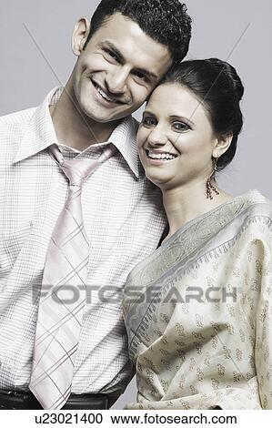 Portrait of a young couple smiling View Large Photo Image Stock Image - Portrait of a young couple smiling. Fotosearch