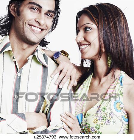 Portrait of a young couple smiling View Large Photo Image Stock Image - Portrait of a young couple smiling. Fotosearch