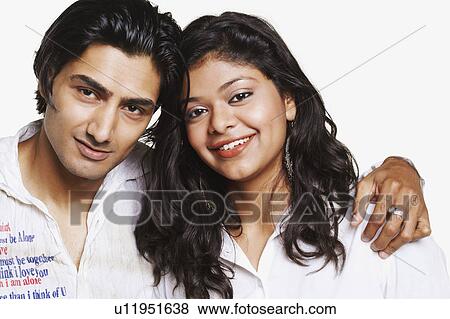 Stock Photo - Portrait of a young couple smiling. Fotosearch