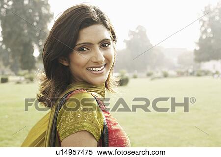 Stock Photography - Portrait of a young woman smiling. Fotosearch