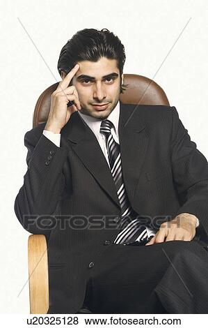 Portrait of a businessman with his head in his hand View Large Photo Image Stock Photo - Portrait of a businessman with his head in his hand. Fotosearch