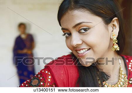 Close-up of a young woman smiling, Agra Fort, Agra, Uttar Pradesh, India View Large Photo Image Stock Image - Close-up of a young woman smiling, Agra Fort, Agra, Uttar Pradesh, India. Fotosearch