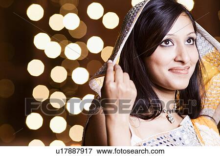 Stock Photo - Close-up of a young woman smiling. Fotosearch