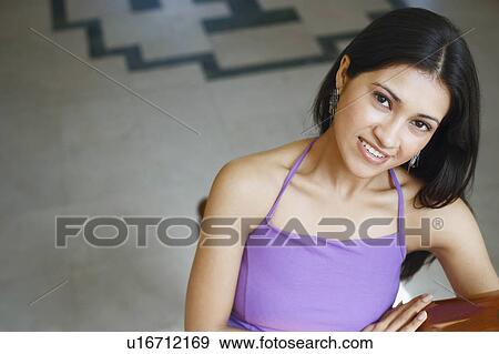 Stock Photo - Portrait of a young woman smiling. Fotosearch