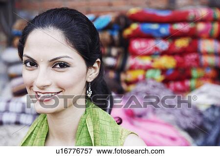 Stock Photo - Portrait of a young woman smiling. Fotosearch