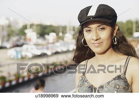 Stock Photo - Portrait of a young woman smiling. Fotosearch