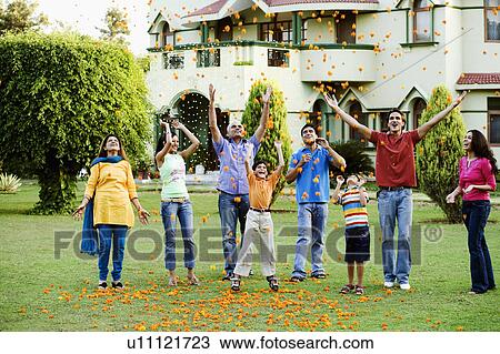 Group of people tossing flowers View Large Photo Image Stock Image - Group of people tossing flowers. Fotosearch