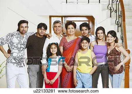 Portrait of a family standing together View Large Photo Image Stock Image - Portrait of a family standing together. Fotosearch