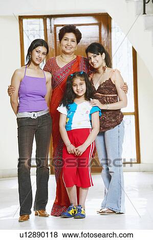 Stock Photo - Portrait of a family standing together. Fotosearch