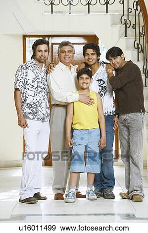 Stock Photo - Portrait of a family standing together. Fotosearch
