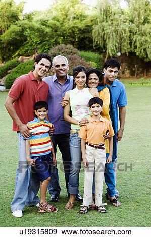 Stock Photo - Portrait of a group of people standing together and smiling. Fotosearch