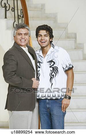 Portrait of a mature man and his son smiling View Large Photo Image Picture - Portrait of a mature man and his son smiling. Fotosearch