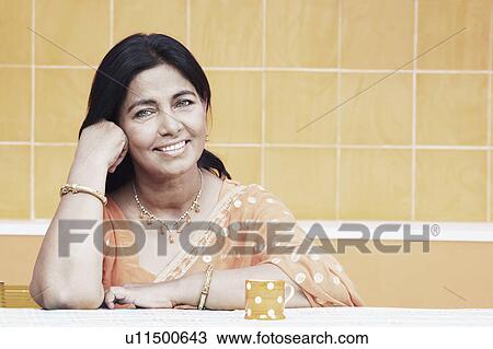Portrait of a mature woman smiling View Large Photo Image Stock Image - Portrait of a mature woman smiling. Fotosearch