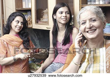 Three women in the kitchen View Large Photo Image Stock Photo - Three women in the kitchen. Fotosearch