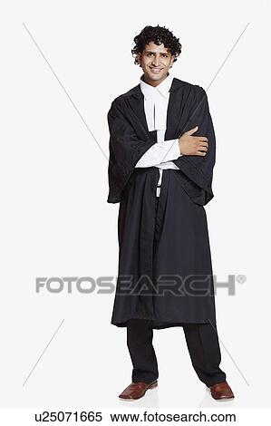 Portrait of a male lawyer standing and smiling View Large Photo Image Stock Photography - Portrait of a male lawyer standing and smiling. Fotosearch