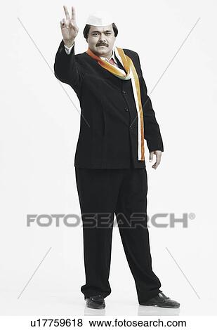 Stock Photo - Portrait of a mature man showing a peace sign. Fotosearch
