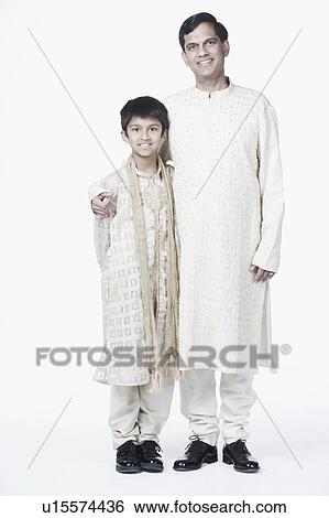 Portrait of a mature man standing with his arm around his son View Large Photo Image Stock Photograph - Portrait of a mature man standing with his arm around his son. Fotosearch