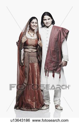 Portrait of a newlywed couple smiling View Large Photo Image Stock Photograph - Portrait of a newlywed couple smiling. Fotosearch