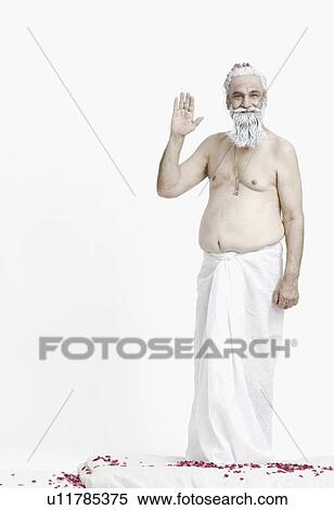 Stock Photography - Portrait of a priest giving blessings. Fotosearch