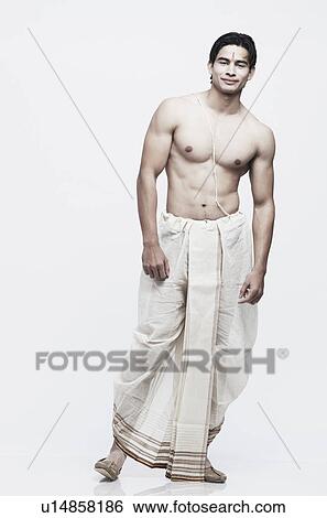 Stock Photograph - Portrait of a young man in traditional clothing. Fotosearch
