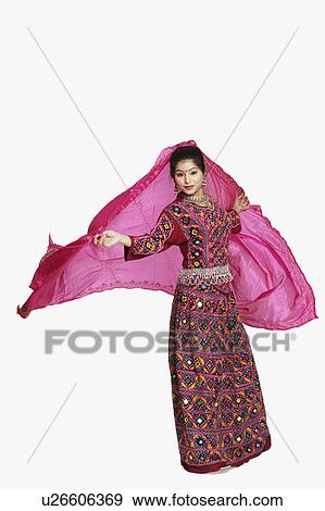 Portrait of a young woman holding her stole and posing View Large Photo Image Stock Photo - Portrait of a young woman holding her stole and posing. Fotosearch