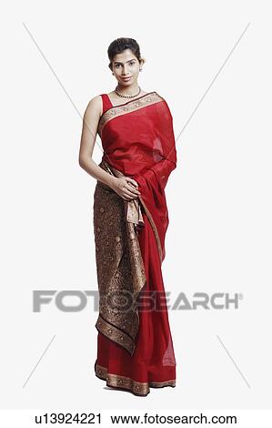 Portrait of a young woman wearing a sari View Large Photo Image Stock Image - Portrait of a young woman wearing a sari. Fotosearch