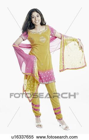 Portrait of a young woman wearing a salwar kameez View Large Photo Image Stock Photography - Portrait of a young woman wearing a salwar kameez. Fotosearch