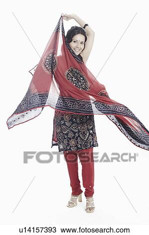 Portrait of a young woman with a stole in her hand posing View Large Photo Image Stock Image - Portrait of a young woman with a stole in her hand posing. Fotosearch